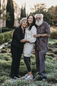 Portrait of happy friends standing outdoors