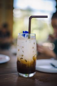 Close-up of drink in glass on table at restaurant