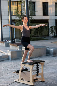 Young woman exercising in gym