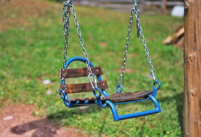 Closeup of children swing in backyard