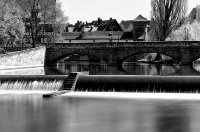 Bridge over river against sky