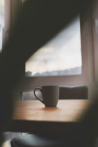 Close-up of coffee cup on table