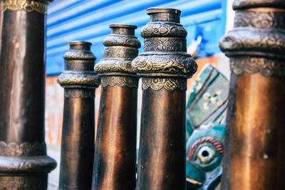 Close-up of old metallic structures at temple