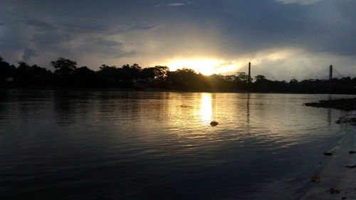Scenic view of lake at sunset