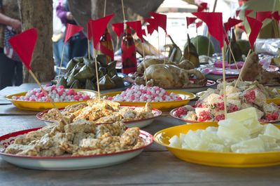 Various desserts with flags on table during wedding