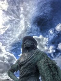 Low angle view of statue against cloudy sky