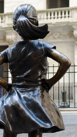 Rear view of woman statue outdoors