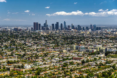 Aerial view of modern buildings in city against sky