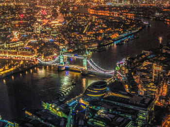 High angle view of illuminated bridge over river at night