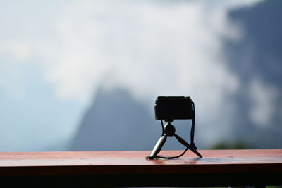 Close-up of camera on table