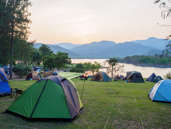 Scenic view of tent on field against sky