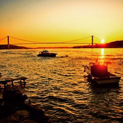 Scenic view of river against sky during sunset