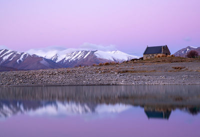 The beautiful colors of the sunset and the reflection of the snow-capped mountains and lakes