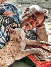 Portrait of cat sleeping on bed