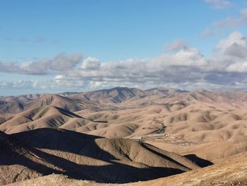 Scenic view of desert against sky