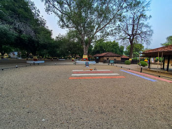 View of playground against buildings in city