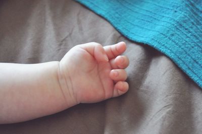 Low section of woman with baby feet