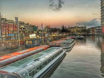 Illuminated city at sunset