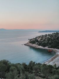 Scenic view of sea against sky at sunset