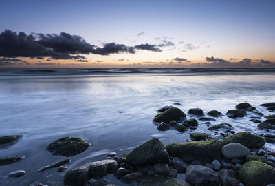 Scenic view of sea against sky during sunset