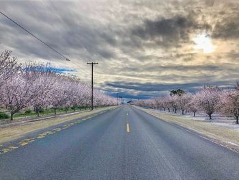 Empty road against sky