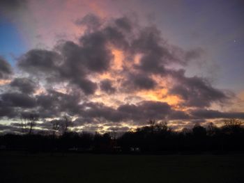 Scenic view of landscape against cloudy sky