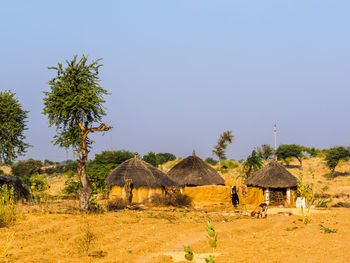 Man on field against clear sky