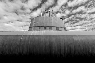 Low angle view of  war submarine against sky