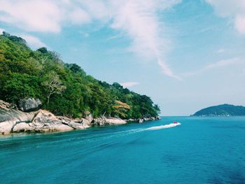 Scenic view of sea against cloudy sky