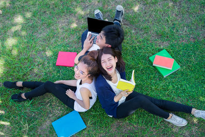 High angle view of woman lying on grass