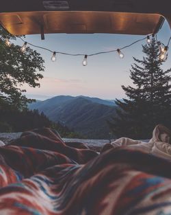 Blankets against mountains at sunset