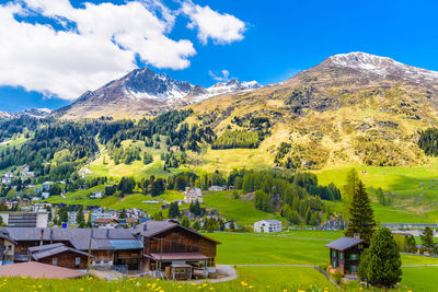 Scenic view of trees and mountains against sky