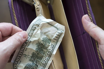 Close-up of man holding woman hand