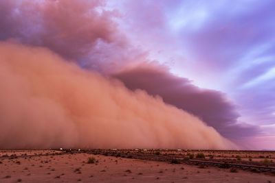 Scenic view of dramatic sky over land