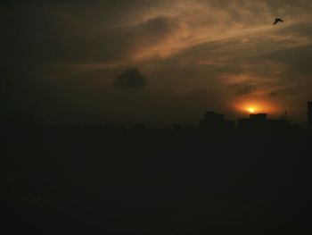 Silhouette of trees against sky at sunset