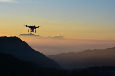 Low angle view of drone at dusk