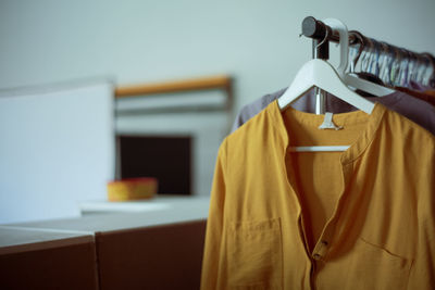 Close-up of clothes drying on table at home