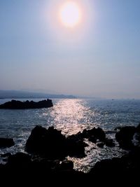 Scenic view of sea against clear sky during sunset