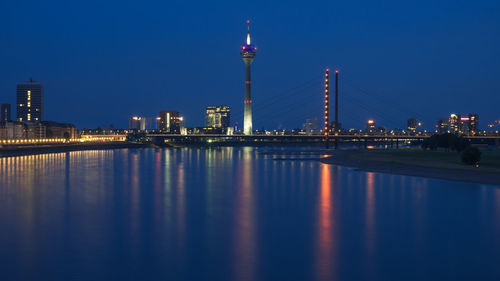 Illuminated city at waterfront