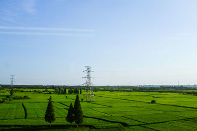 Scenic view of grassy field against cloudy sky