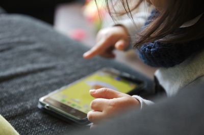 Close-up of man using mobile phone