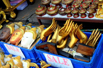 High angle view of various art decors for sale at market stall