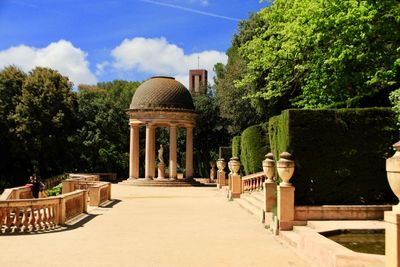 Gazebo in park against building