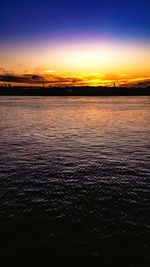 Scenic view of sea against romantic sky at sunset