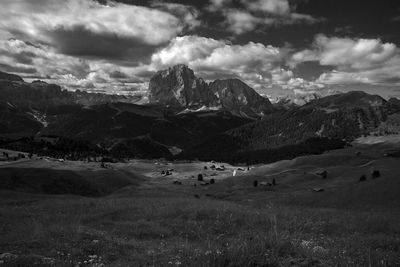 Scenic view of field against sky in dolomites