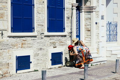 Rear view of man standing outside building