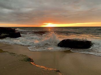 Scenic view of sea against sky during sunset