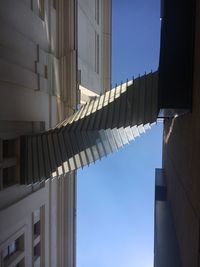 Low angle view of buildings in city against sky