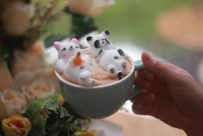 Close-up of hand holding ice cream