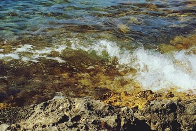 Waves splashing on rocks